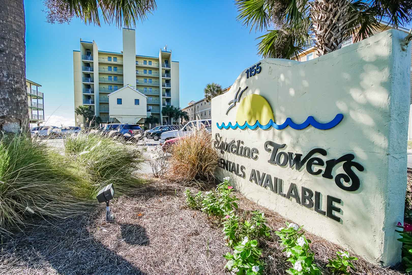 A beautiful resort entrance and signage at VRI's Shoreline Towers in Gulf Shores, Alabama.